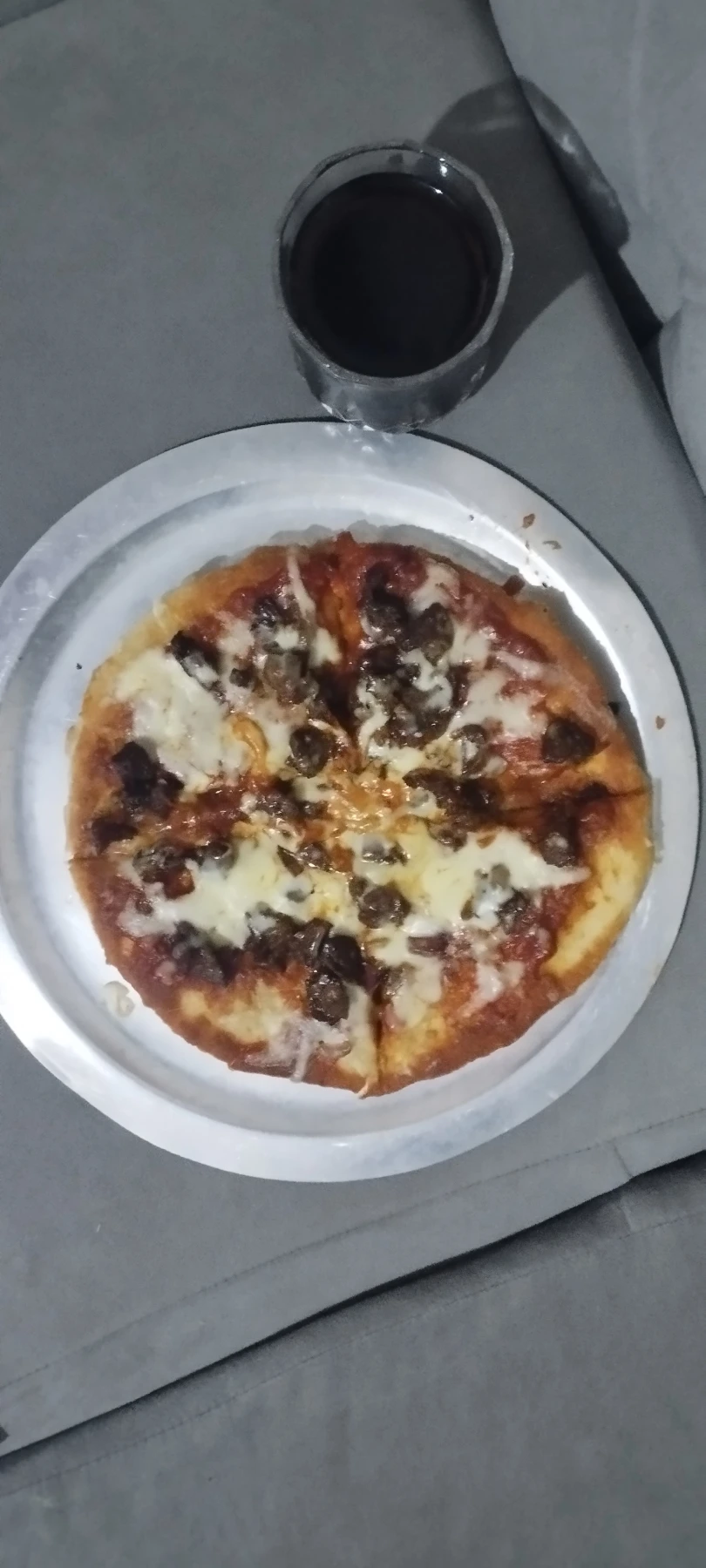 Homemade beef pizza with mozzarella cheese